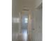 Bright hallway with tile floors and white doors at 736 Nw 31St Ct, Winter Haven, FL 33881
