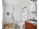 Elegant bathroom with marble-patterned wall and stylish vanity at 7623 Excitement Dr, Reunion, FL 34747