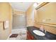 Traditional bathroom features granite countertop and shower over tub at 7623 Excitement Dr, Reunion, FL 34747