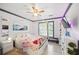 Charming bedroom with decorative lighting and hardwood floors at 7623 Excitement Dr, Reunion, FL 34747