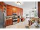 Kitchen showcasing stainless steel appliances, granite countertops and seamlessly flowing to the dining area at 7623 Excitement Dr, Reunion, FL 34747