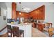 Kitchen with wood cabinetry, granite counters, and stainless steel appliances at 7623 Excitement Dr, Reunion, FL 34747
