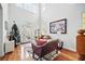 Cozy living room with lots of natural light and soaring ceiling at 7623 Excitement Dr, Reunion, FL 34747