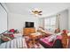 Upstairs living room with carpeted floor, ceiling fan, and ample seating at 7623 Excitement Dr, Reunion, FL 34747