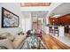 Open-concept living room with hardwood floors and a staircase to the second floor at 7623 Excitement Dr, Reunion, FL 34747