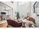 Inviting living room with soaring ceilings, open to the dining area, and hardwood floors at 7623 Excitement Dr, Reunion, FL 34747