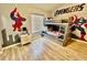 Avengers themed bedroom with hardwood floors, gray bunk beds and a custom Spiderman wall mural at 7660 Otterspool St, Kissimmee, FL 34747