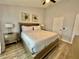 Comfortable bedroom featuring a queen bed, nightstands, and ceiling fan at 7660 Otterspool St, Kissimmee, FL 34747