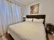Cozy bedroom featuring a queen bed and neutral decor at 7660 Otterspool St, Kissimmee, FL 34747