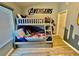 Avengers themed bedroom with hardwood floors, gray bunk beds and a Captain America wall mural at 7660 Otterspool St, Kissimmee, FL 34747