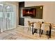 Cozy dining area featuring a modern table and chairs with a decorative fireplace at 7660 Otterspool St, Kissimmee, FL 34747
