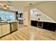 Open-concept kitchen with stainless steel appliances and bar seating at 7660 Otterspool St, Kissimmee, FL 34747
