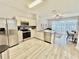 Well-lit kitchen with stainless steel appliances and an open floor plan at 7660 Otterspool St, Kissimmee, FL 34747