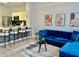 Open-concept living area with a kitchen island and comfortable seating at 7660 Otterspool St, Kissimmee, FL 34747