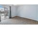 Cozy bedroom with plush carpet, sliding glass doors to outdoor patio at 8122 Yellow Crane Dr, Kissimmee, FL 34747