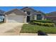 Charming single-Gathering home with well-maintained landscaping and a two-car garage at 8122 Yellow Crane Dr, Kissimmee, FL 34747