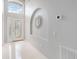 Bright foyer with tiled floors, high ceilings, and decorative mirror at 8122 Yellow Crane Dr, Kissimmee, FL 34747