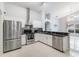 Modern kitchen featuring stainless steel appliances and granite countertops at 8122 Yellow Crane Dr, Kissimmee, FL 34747