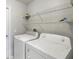 Functional laundry room with modern washer and dryer at 8122 Yellow Crane Dr, Kissimmee, FL 34747
