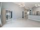 Bright and airy living room with tiled floors and screened patio access at 8122 Yellow Crane Dr, Kissimmee, FL 34747