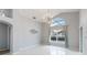 Bright living room with high ceilings and a large window at 8122 Yellow Crane Dr, Kissimmee, FL 34747