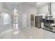 Spacious open floor plan showing the entry, laundry, and kitchen with modern fixtures at 8122 Yellow Crane Dr, Kissimmee, FL 34747
