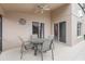 Covered outdoor patio features neutral walls and a ceiling fan for additional comfort at 8122 Yellow Crane Dr, Kissimmee, FL 34747