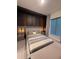 Serene bedroom with elegant headboard, ambient lighting, and striped bedding at 8289 Topsail Pl, Winter Garden, FL 34787