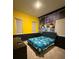 Fun bedroom featuring minion themed decor, tv, and a dresser at 8289 Topsail Pl, Winter Garden, FL 34787
