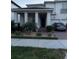 Charming two-story home with a well-maintained lawn, two-car garage, and brick paved driveway at 8289 Topsail Pl, Winter Garden, FL 34787