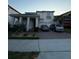 Charming two-story home with a well-maintained lawn, two-car garage, and brick paved driveway at 8289 Topsail Pl, Winter Garden, FL 34787