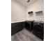 Functional laundry room with modern appliances, sink, and storage space at 8289 Topsail Pl, Winter Garden, FL 34787