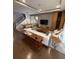 Contemporary living room featuring modern decor, hardwood floors, staircase and open floor plan at 8289 Topsail Pl, Winter Garden, FL 34787