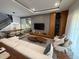 Open concept living and dining area with modern decor, sleek hardwood floors, and abundant natural light at 8289 Topsail Pl, Winter Garden, FL 34787