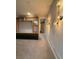 Bright living room featuring custom built-ins and modern lighting fixtures at 8289 Topsail Pl, Winter Garden, FL 34787