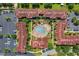 A vast aerial view of resort buildings surrounding a central courtyard, with palm trees, green spaces, and pools at 841 Retreat Blvd # 101, Davenport, FL 33897