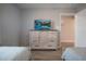 Cozy bedroom featuring two twin beds, light wood furniture, and soft, muted colors at 841 Retreat Blvd # 101, Davenport, FL 33897