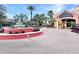 A beautiful fountain and landscaping grace the entrance to the Regal Palms Resort, with a peek at the hotel entrance at 841 Retreat Blvd # 101, Davenport, FL 33897