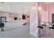 Charming ice cream shop with retro black and white tiled floors and pink striped walls, plus ample seating at 841 Retreat Blvd # 101, Davenport, FL 33897