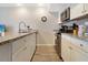 Cozy kitchen with stainless steel appliances, granite countertops, and modern cabinetry at 841 Retreat Blvd # 101, Davenport, FL 33897
