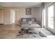 Inviting living room with wood floors, neutral walls, comfortable seating, and lots of light at 841 Retreat Blvd # 101, Davenport, FL 33897