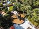 Aerial view of a playground with slide and climbing structure nestled in tropical foliage at 841 Retreat Blvd # 101, Davenport, FL 33897