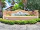 Attractive Regal Palms at Highland Reserve entrance sign surrounded by lush landscaping and palm trees at 841 Retreat Blvd # 101, Davenport, FL 33897