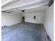 Clean and spacious two car garage with a neutral color pallete at 9081 Oscraft Dr, Davenport, FL 33896