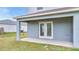 Concrete slab leading to a grassy, fenced-in backyard at 943 Van Loon Ct, Kissimmee, FL 34758