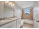 Bathroom showcasing double sink vanity and shower-tub combo at 943 Van Loon Ct, Kissimmee, FL 34758
