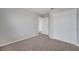 Carpeted bedroom with white trim and a large closet at 943 Van Loon Ct, Kissimmee, FL 34758