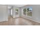 Bright bedroom with three windows and neutral paint for a calm and inviting space at 943 Van Loon Ct, Kissimmee, FL 34758