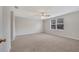 Spacious bedroom with neutral walls, carpet, ceiling fan, and a window at 943 Van Loon Ct, Kissimmee, FL 34758