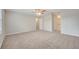 Bedroom with carpet, ceiling fan, and doorway leading to bathroom at 943 Van Loon Ct, Kissimmee, FL 34758